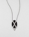 From the Soho Collection. Rich black spinels accented with a white sapphire criss cross design set in sterling silver on a delicate link chain. Black spinel and white sapphireSterling silver Length, about 16Pendant size, about 1.2Lobster clasp closureImported 