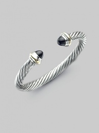 From the Color Classics Collection. The signature Yurman cable, in a bold bangle capped with black onyx domes and accents of 14k gold. Black onyx Sterling silver and 14k yellow gold Cable, 7mm Diameter, about 2¼ Imported From the Color Classics Collection. The signature Yurman cable, in a bold bangle capped with black onyx domes and accents of 14k gold. Black onyx Sterling silver and 14k yellow gold Cable, 7mm Diameter, about 2¼ Imported