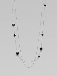 A long, delicate piece with beautiful round black agate stations on one of the two sterling silver link chains. Black agateSterling silverLength, about 39¾Clasp closureImported 