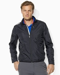 A sporty, water-resistant jacket is styled in a breathable, lightweight construction with ventilating perforations for high performance. A sporty, water-resistant jacket is styled in a breathable, lightweight construction with ventilating perforations for high performance.