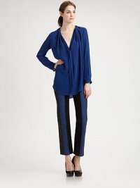 Soft pleating all around the neckline defines the graceful shape of this slightly sheer silk design with ties at the neck.Round neckline with front V and pleatingSoft self tiesPullover stylingLong sleeves with bracelet cuffsModified shirttail hemAbout 27 from shoulder to hemSilkDry cleanImportedSIZE & FITModel shown is 5'9 (175cm) wearing US size 4. Soft pleating all around the neckline defines the graceful shape of this slightly sheer silk design with ties at the neck.Round neckline with front V and pleatingSoft self tiesPullover stylingLong sleeves with bracelet cuffsModified shirttail hemAbout 27 from shoulder to hemSilkDry cleanImportedSIZE & FITModel shown is 5'9 (175cm) wearing US size 4.