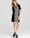 Sequins lend sparkle to this bold, monochrome Nanette Lepore dress with houndstooth printed front panel.