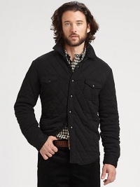 A unique quilted shirt-jacket, designed for lightweight warmth features leather detailing at the elbows and collar for a hint of rugged edge.Button-frontChest flap pocketsFully linedAbout 30 from shoulder to hemCottonDry cleanImported