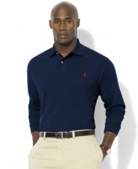 Designed in a relaxed classic fit with looser sleeves, a wider body and a longer hem, this long-sleeved polo shirt is rendered in breathable cotton mesh for handsome style. Designed in a relaxed classic fit with looser sleeves, a wider body and a longer hem, this long-sleeved polo shirt is rendered in breathable cotton mesh for handsome style.