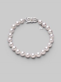 From the Akoya Collection. A simple strand of lustrous white cultured Akoya pearls with a signature filigree clasp. 7mm white, round cultured pearls Quality: A1 18k white gold Length, about 7 Mikimoto signature clasp Imported From the Akoya Collection. A simple strand of lustrous white cultured Akoya pearls with a signature filigree clasp. 7mm white, round cultured pearls Quality: A1 18k white gold Length, about 7 Mikimoto signature clasp Imported