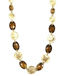 Jones New York's chic collar necklace is distinctively decorated with smokey quartz-colored stones, as well as round disc accents. Crafted in gold tone mixed metal. Approximate length: 17 inches. Jones New York's chic collar necklace is distinctively decorated with smokey quartz-colored stones, as well as round disc accents. Crafted in gold tone mixed metal. Approximate length: 17 inches.