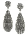 Vince Camuto's teardrop earrings light up the night. Crafted from silver-tone mixed metal, the pair features glistening pave crystal accents for a radiant touch. With a circular post closure. Approximate drop: 1-3/4 inches.