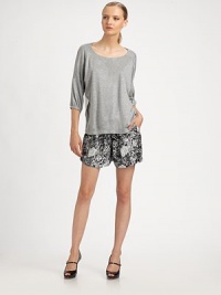 The casual front of this blousy style is belied by an alluring sheer back panel.ScoopneckThree-quarter sleeves with banded cuffsDelicately gathered sheer back panel90% viscose/10% polyamideDry cleanMade in USA of Italian fabricModel shown is 5'9 (175cm) wearing US size Small. The casual front of this blousy style is belied by an alluring sheer back panel.ScoopneckThree-quarter sleeves with banded cuffsDelicately gathered sheer back panel90% viscose/10% polyamideDry cleanMade in USA of Italian fabricModel shown is 5'9 (175cm) wearing US size Small.