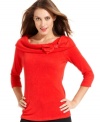 A rhinestone bow at the cowl neckline makes this AGB sweater a festive piece for the season ahead!