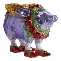 Dressed in her namesake color with bright red shoes and glittery golden wings, Violetta is a hand-painted, sparkling addition to your tree. Dressed in her namesake color with bright red shoes and glittery golden wings, Violetta is a hand-painted, sparkling addition to your tree.