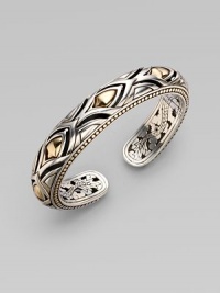 From the Naga Collection. A stunning hinged cuff, both graceful and bold, combines sterling silver and 18k yellow gold with graphic, textural richness. 18k yellow gold and sterling silver Diameter, about 2½ Width, about ½ Hinged Made in Bali From the Naga Collection. A stunning hinged cuff, both graceful and bold, combines sterling silver and 18k yellow gold with graphic, textural richness. 18k yellow gold and sterling silver Diameter, about 2½ Width, about ½ Hinged Made in Bali