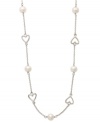 Sweet romance. This delicate sterling silver necklace features petite, cut-out hearts and cultured freshwater pearls (6-6-1/2 mm). Approximate length: 16-1/2 inches.