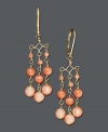 Add a splash of citrus color to your summer ensemble. Chandelier-style earrings feature three delicate strands of coral beads in a 14k gold setting. Approximate drop: 1 inch.