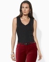 Whether worn alone or layered with a favorite topper, this shimmering knit V-neck adds tasteful twinkle to any ensemble.