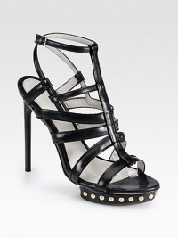 Head-turning leather silhouette with edgy metal studs, a powerful island platform and adjustable slingback strap. Lacquered heel, 5 (125mm)Studded island platform, 1 (25mm)Compares to a 4 heel (100mm)Studded leather upperAdjustable slingback strapLeather liningLeather and rubber solePadded insoleMade in Italy Head-turning leather silhouette with edgy metal studs, a powerful island platform and adjustable slingback strap. Lacquered heel, 5 (125mm)Studded island platform, 1 (25mm)Compares to a 4 heel (100mm)Studded leather upperAdjustable slingback strapLeather liningLeather and rubber solePadded insoleMade in Italy