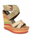 Here comes summer style. With an earthy, woven wraparound strap at the ankle and a sky-high wedge heel with braided trim at the bottom, the Surayya platform sandals by RACHEL Rachel Roy are decked out and ready for sun.