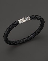 A sterling silver bamboo pushlock is a bold finish to this braided leather bracelet from the John Hardy Bamboo Collection. A sterling silver bamboo pushlock is a bold finish to this braided leather bracelet from the John Hardy Bamboo Collection.