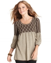 Studio M's sweater features bishop sleeves and a contasting, cable-knit-inspired detail at the chest and shoulders. Studio M's sweater features bishop sleeves and a contasting, cable-knit-inspired detail at the chest and shoulders.