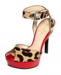 A perfect pick for summer. The Tulip platform sandals by Marc Fisher feature a sexy leopard print that's accented with a pop of bright red on the platform. A perfect pick for summer. The Tulip platform sandals by Marc Fisher feature a sexy leopard print that's accented with a pop of bright red on the platform.