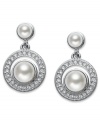 Polished perfection. A polished simulated pearl (6 mm) with genuine mother-of-pearl coating is adorned with round-cut crystal accents on Eliot Danori's elegant drop earrings. Set in rhodium-plated mixed metal. Approximate drop: 1/2 inch.