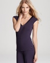 A sleeveless pajama top with a contrast silk trimmed neckline from Calvin Klein. Style #S2450