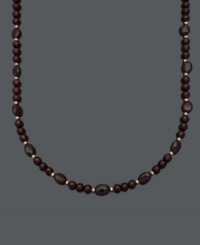 Sophistication in rich red hues. Set off your look with this beautiful necklace highlighting 6 millimeter and 6 x 8 millimeter garnet beads (150 ct. t.w.) and 14k gold accent beads and clasp. Approximate length: 18 inches. Sophistication in rich red hues. Set off your look with this beautiful necklace highlighting 6 millimeter and 6 x 8 millimeter garnet beads (150 ct. t.w.) and 14k gold accent beads and clasp. Approximate length: 18 inches.