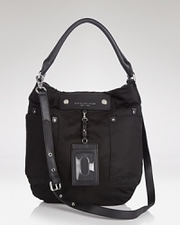 MARC BY MARC JACOBS' leather hobo take its cues from school-yard chic. The durable nylon bag touts essentials (or books,) making it a perfect partner for your day-to-day uniform. MARC BY MARC JACOBS' leather hobo take its cues from school-yard chic. The durable nylon bag touts essentials (or books,) making it a perfect partner for your day-to-day uniform.