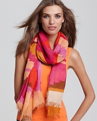 Vibrant zigzagging pattern decorate this large oblong scarf from Theodora & Callum. Vibrant zigzagging pattern decorate this large oblong scarf from Theodora & Callum.