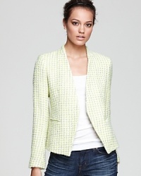 Ablaze with texture, this tweed Theory blazer has a sleek open front design. Slit pockets and a plain lapel contribute to its chic aesthetic. Ablaze with texture, this tweed Theory blazer has a sleek open front design. Slit pockets and a plain lapel contribute to its chic aesthetic.