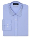 Dress shirt with spread collar, two button barrel cuffs and a contemporary fit through the body, with a solid blue hue.