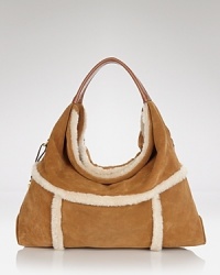 UGG® Australia tackles the textured trend with this lush hobo, crafted of a cool mix of suede with shearling trims. Carry it to send a mixed material message.