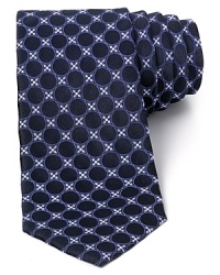 The negative space of the circle pattern creates an alluring three-dimensional effect on this lavish silk tie from Valentino, a unique addition to your refined collection. The negative space of the circle pattern creates an alluring three-dimensional effect on this lavish silk tie from Valentino, a unique addition to your refined collection.