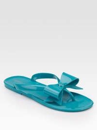 A dazzling emblem and a charming bow dress up this simple thong design.PVC upper PVC sole Bow detail with metallic emblem Imported A dazzling emblem and a charming bow dress up this simple thong design.PVC upper PVC sole Bow detail with metallic emblem Imported