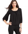 Studio M heighten this scoopneck top's style with a textured detail around the neckline and chic bishop sleeves.