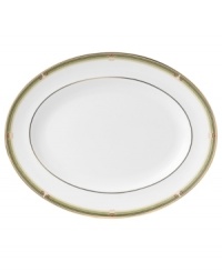 The exotic floral design of the Oberon dinnerware and dishes pattern by Wedgwood features soft shades of green and gold accented with black, against white bone china. The exotic floral design of the Oberon dinnerware and dishes pattern by Wedgwood features soft shades of green and gold accented with black, against white bone china.