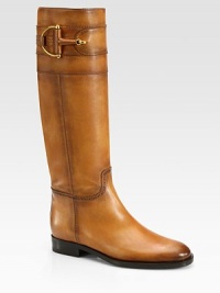 Leather design with stitch accents and signature horsebit hardware. Stacked heel, 1 (25mm)Shaft, 16Leg circumference, 14¼Leather upperPull-on styleLeather lining and solePadded insoleMade in Italy Leather design with stitch accents and signature horsebit hardware. Stacked heel, 1 (25mm)Shaft, 16Leg circumference, 14¼Leather upperPull-on styleLeather lining and solePadded insoleMade in Italy