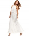 Xscape's gown is beautifully striking with a blouson bodice and pleating throughout the dress.