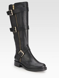 Edgy leather silhouette commands attention with gleaming buckle hardware and an exposed zipper. Rubber heel, 1¼ (30mm)Shaft, 15¼Leg circumference, 14½Leather upperSide zip with adjustable buckle strapsLeather liningRubber solePadded insoleImported Edgy leather silhouette commands attention with gleaming buckle hardware and an exposed zipper. Rubber heel, 1¼ (30mm)Shaft, 15¼Leg circumference, 14½Leather upperSide zip with adjustable buckle strapsLeather liningRubber solePadded insoleImported