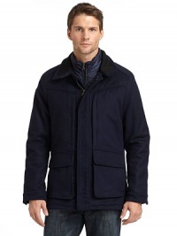 THE LOOKStand collarZip front with snap storm flapDrawcord waistSnap flap pocketsSnap cuffsRemovable down vestTHE FITAbout 27 from shoulder to hemTHE MATERIALOuter shell: 80% wool/20% cashmereOuter fill: polyesterInner shell: polyesterInner fill: 80/20 duck downFully linedCARE & ORIGINDry clean Imported THE LOOKStand collarZip front with snap storm flapDrawcord waistSnap flap pocketsSnap cuffsRemovable down vestTHE FITAbout 27 from shoulder to hemTHE MATERIALOuter shell: 80% wool/20% cashmereOuter fill: polyesterInner shell: polyesterInner fill: 80/20 duck downFully linedCARE & ORIGINDry clean Imported