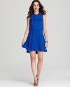 Rock a contrast cool look in this Aqua dress. The bright blue color is fashionably interrupted by the black neckline and pocket trim.