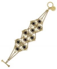 Postmodern flair. Jessica Simpson's draped chain bracelet, crafted from gold-tone mixed metal with faceted red stone accents, epitomizes contemporary chic. Approximate length: 8 inches. Postmodern flair. Jessica Simpson's draped chain bracelet, crafted from gold-tone mixed metal with faceted red stone accents, epitomizes contemporary chic. Approximate length: 8 inches.