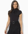 Lauren by Ralph Lauren's sleek jersey top is modernized with chic cap sleeves and a turtleneck with ties at the side, adding dramatic allure to any look.