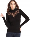 Sheer lace adds a hint of sultriness to this GUESS turtleneck for spiced-up cold-weather style!