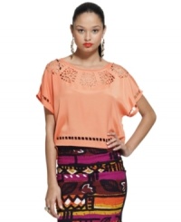 Inspired by the bold style of Brasil, this Bar III boxy top features cutout details that add eye-catching appeal! Inspired by the bold style of Brasil, this Bar III boxy top features cutout details that add eye-catching appeal!
