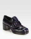 A large buckle tops this moccasin-inspired oxford silhouette, rendered in glossy patent leather. Stacked heel, 2¼ (60mm)Stacked platform, ½ (15mm)Compares to a 1¾ heel (45mm)Patent leather upperAdjustable buckle strapLeather lining and solePadded insoleMade in ItalyThis style runs small. We recommend ordering one half size up for a standard fit. 