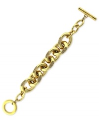 Bold and beautiful. This chain bracelet from Vince Camuto is crafted from gold-tone mixed metal, with glass crystal pave accents adding a lustrous touch. Approximate length: 8 inches. Bold and beautiful. This chain bracelet from Vince Camuto is crafted from gold-tone mixed metal, with glass crystal pave accents adding a lustrous touch. Approximate length: 8 inches.
