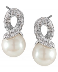 Add a simple twist. Carolee's elegant knot-shaped stud earrings feature a post backing with polished glass pearls and sparkling glass accents. Set in silver tone mixed metal. Approximate drop: 3/4 inch. Add a simple twist. Carolee's elegant knot-shaped stud earrings feature a post backing with polished glass pearls and sparkling glass accents. Set in silver tone mixed metal. Approximate drop: 3/4 inch.