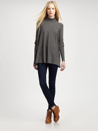 Eye-catching turtleneck with elegant, mock-layered poncho sleeves, ribbed trim and a long silhouette. Ribbed turtleneckDropped shouldersMock-layered sleevesRibbed cuffs and hemAbout 27 from shoulder to hem54% nylon/25% rayon/21% modalHand washImportedModel shown is 5'10 (177cm) wearing US size Small. Eye-catching turtleneck with elegant, mock-layered poncho sleeves, ribbed trim and a long silhouette. Ribbed turtleneckDropped shouldersMock-layered sleevesRibbed cuffs and hemAbout 27 from shoulder to hem54% nylon/25% rayon/21% modalHand washImportedModel shown is 5'10 (177cm) wearing US size Small.