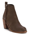 These tough-luxe little booties provide a rugged finish to fall's ladylike frocks. By Dolce Vita.