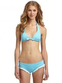 THE LOOKAdjustable halter straps tie at neckRemovable center bowAdjustable triangle cupsBack tie closureTHE MATERIAL80% nylon/20% spandexCARE & ORIGINHand washMade in USA of imported fabricPlease note: Bikini bottom sold separately. THE LOOKAdjustable halter straps tie at neckRemovable center bowAdjustable triangle cupsBack tie closureTHE MATERIAL80% nylon/20% spandexCARE & ORIGINHand washMade in USA of imported fabricPlease note: Bikini bottom sold separately.